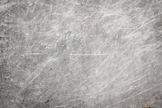 scratched metal sheet with visible texture. background photo