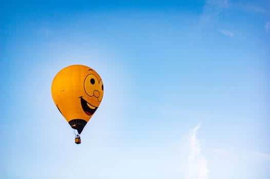 Happy face balloon with blue sky back ground photo