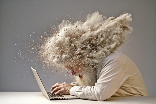 A man with a beard and a laptop photo