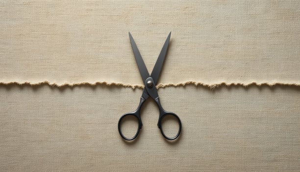 Craft Scissors on Textured Fabric Background with Torn Edge photo
