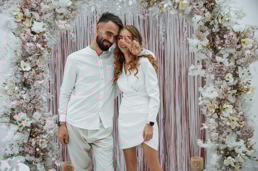 A young, groom with his bride in a white dress. Wedding conception photo