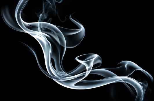 Swirling Smoke Plumes Abstract Art Against Black Background for Creative Design photo