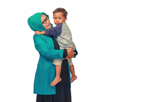 Muslim Mother Holding Her Child with Love and Care photo