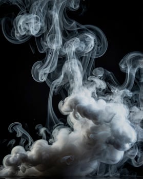Swirling White Smoke Against a Dark Background Creates an Ethereal Effect photo