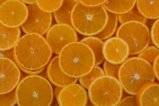 Vibrant orange slices create a colorful display of freshness perfect for summer recipes and healthy snacks photo