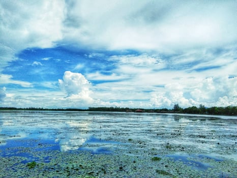 Beautiful Talay Noi Lake and fluffy sky in southern Thailand photo