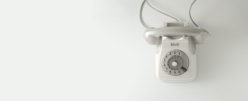 A white vintage dial telephone. photo