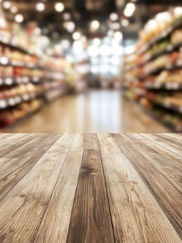 Wooden Floor Perspective View with Blurred Supermarket Aisle Background Template photo