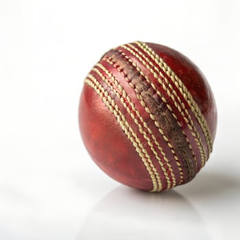 Cricket Ball Fully Round and Shiny Isolated on White Background photo