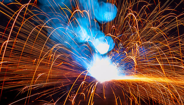 Bright Sparks and Vivid Colors Illuminate a Night Scene During a Lively Celebration With Fireworks and Pyrotechnics photo