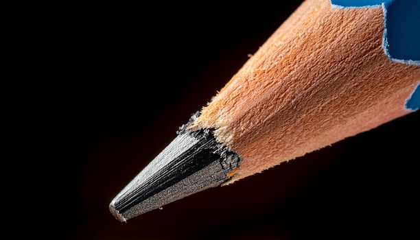 Close-up View of a Sharpened Pencil With a Worn Tip Showcasing Wood and Graphite Texture photo