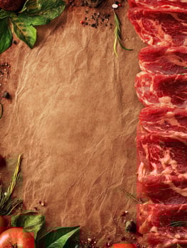 Fresh Beef Steaks on Brown Paper with Herbs and Spices photo