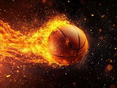 Dynamic basketball soaring through fiery sparks in action scene photo