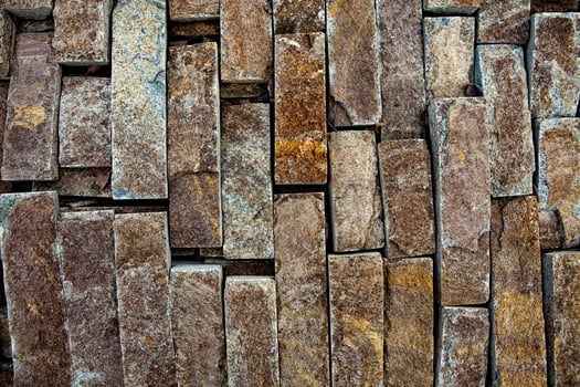 Aging Stone Wall with Visible Signs of Time and Decay photo