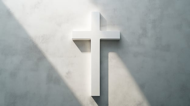 Minimalist white cross on concrete wall with sunlight shadows photo