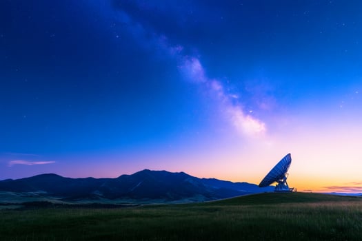 Massive satellite dish reaches for the stars in a mystical twilight sky over serene mountains photo
