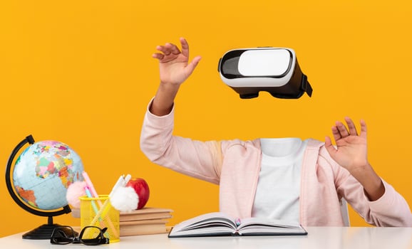 A schooler is immersed in virtual reality, wearing glasses and gesturing hands-free. The vibrant background enhances the tech experience, highlighting the modern gadget's appeal. photo