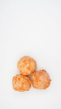 Salmon ball made from processed premium fish paste or surimi isolated on white background photo