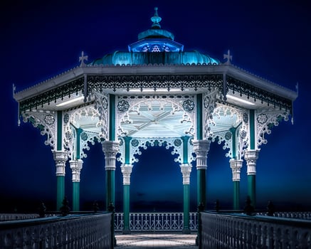 A gazebo lit up at night photo