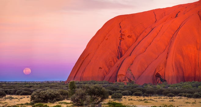 The red rock of uluru, australia, at sunset photo