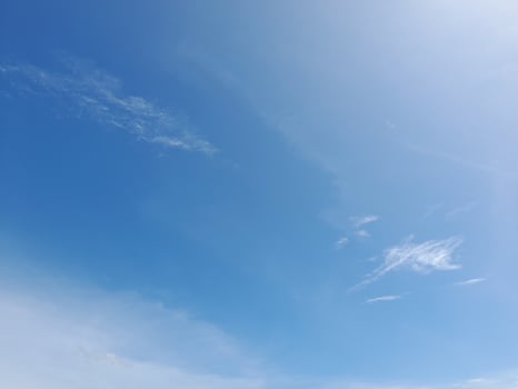 White clouds in the blue sky. Light cloudy, good weather. Curly clouds on a sunny day. photo