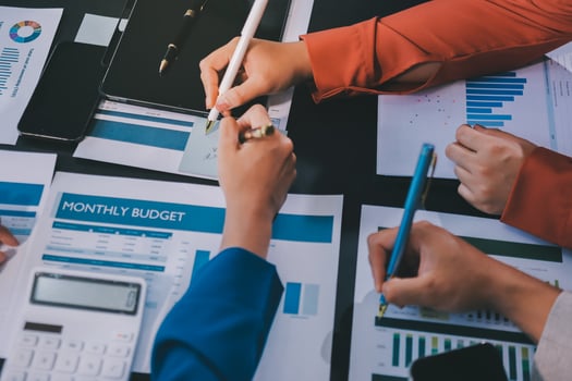 Business people working on a business budget photo
