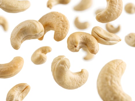 Cashew nuts falling in the air. photo