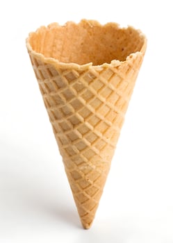 An ice cream cone is shown on a white background. photo