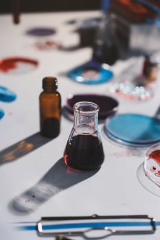 A table with various chemicals and liquids photo