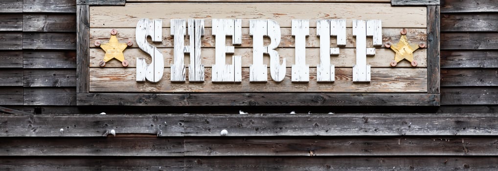 Sheriff sign on vintage background, wild west design. Concepts of justice, protection and security photo