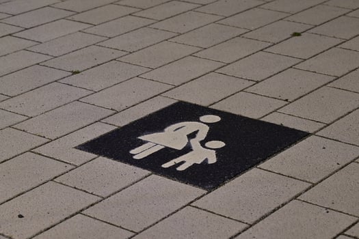 Mother and Child Symbol on Pavement photo