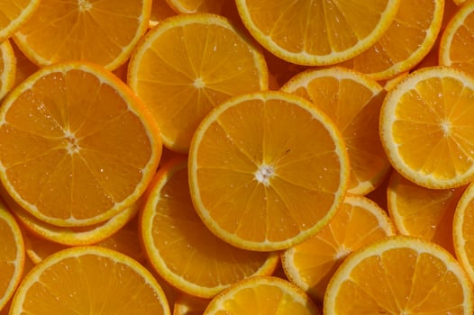 Vibrant citrus slices arranged beautifully, celebrating summer's bounty in a sunlit kitchen photo