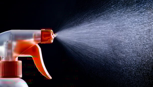 Water Spray Nozzle Releases Mist in Close-Up Against a Dark Background, Showcasing Fine Droplets in a Dynamic Spray Pattern photo