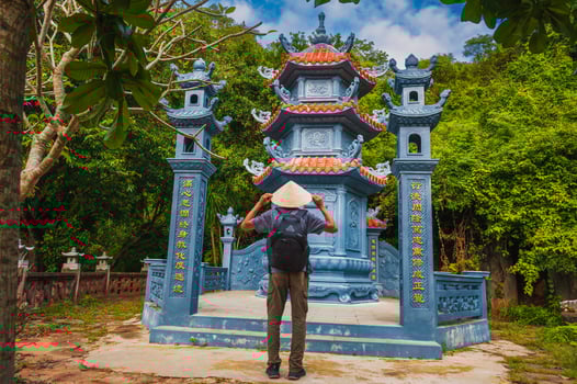 male tourist traveler at temple on Buddhist pagoda in Da Nang, Vietnam. Travel and tourism in Asia photo