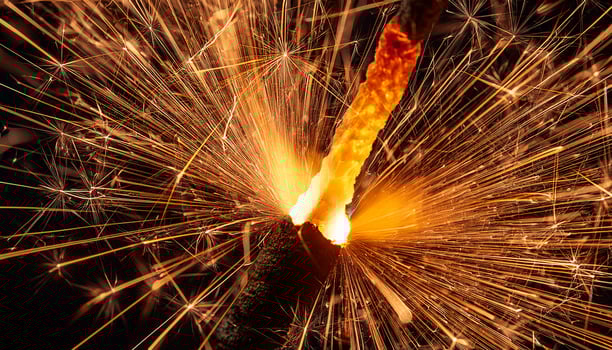Sparkler Creating Bright Sparks During Nighttime Celebration at Outdoor Event With Friends and Family photo
