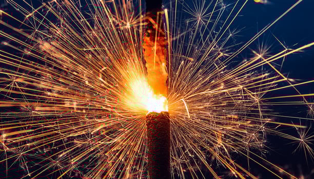 Firework Explosion Creates Vibrant Sparks Against a Dark Night Sky During a Celebration Event photo