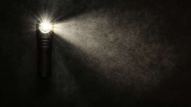 Bright handheld torch piercing the dim surroundings photo