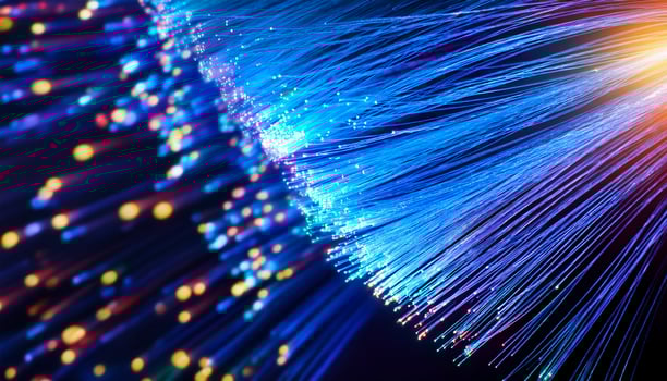 Illuminated Fiber Optic Strands Create a Vibrant Display of Light in a Dark Setting photo
