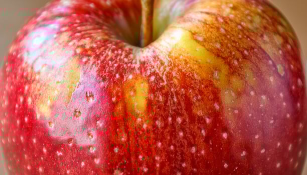 Fresh Red Apple Resting on a Wooden Surface With a Shiny Texture and Vibrant Colors photo
