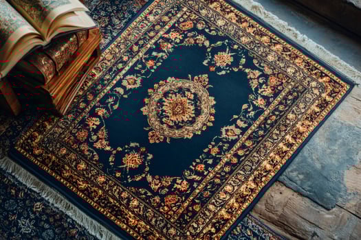 Luxurious prayer rug displaying intricate floral arabesque design with holy book resting on wooden stand photo