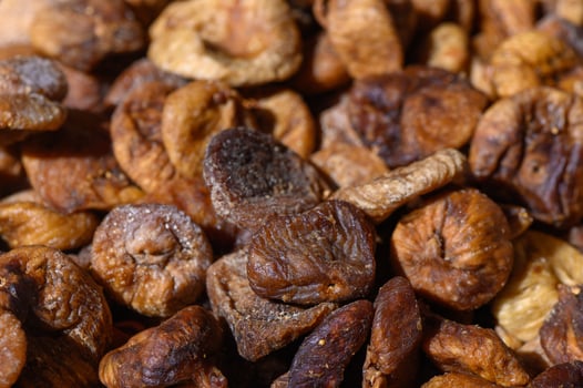 Dried figs showcasing natural sweetness and rich textures at a local market during early afternoon photo