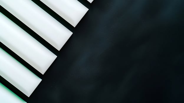 Abstract arrangement of white geometric shapes on a dark background creating a modern aesthetic photo