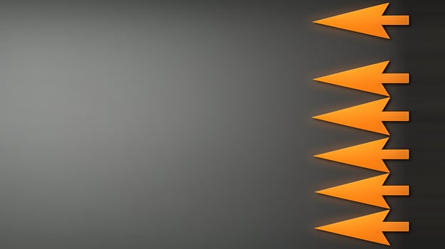 Abstract design featuring multiple orange arrows pointing right against a dark gradient background photo