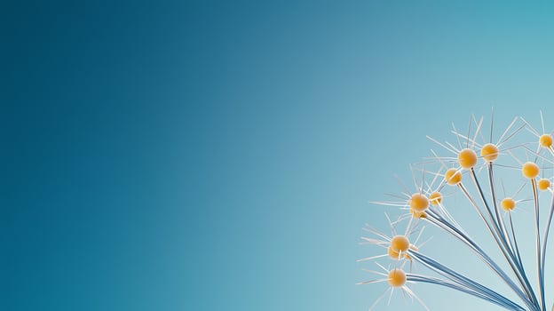 Abstract representation of delicate yellow dandelion seeds against a blue gradient background photo