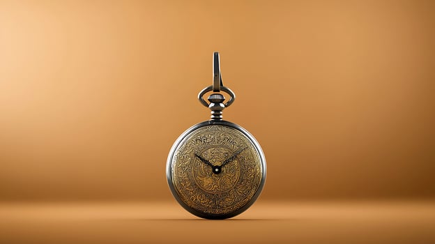 Antique pocket watch with intricate design displayed against a warm orange background photo