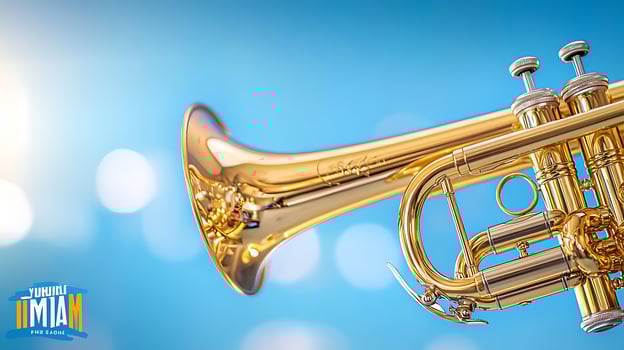 Close-up of a shiny trumpet against a bright blue background with soft bokeh effects photo