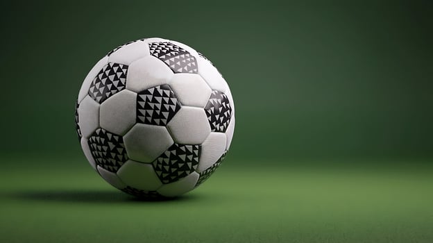 Close-up of a soccer ball on a green background, emphasizing its design and texture photo