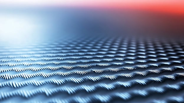 Close-up of textured metallic surface with intricate patterns reflecting ambient light photo
