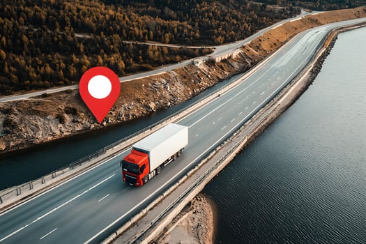 Aerial View of Red Semi Truck Driving on Scenic Highway with GPS Location Pin photo