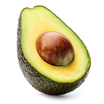 Isolated Avocado Half Showing Pit on White Background in Studio Lighting photo
